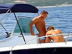 Two hot guys spending hot summeer day driving the boat