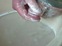 Foreskin washing in a bowl