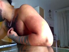 Gay latin stud jerks off his cock until he cums