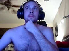 Gay hunk masturbates while watching porn
